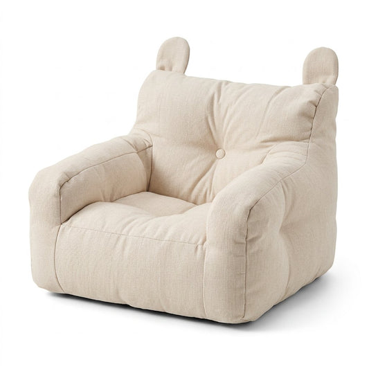 Fauteuil enfant en peluche beige clair, forme ours à oreilles et boutons.