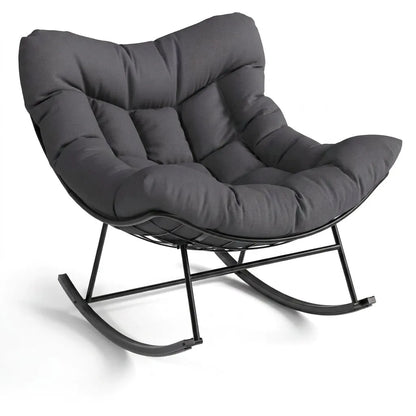Fauteuil œuf XL sombre pivotant, coussin gris et repose-pieds, piètement noir.