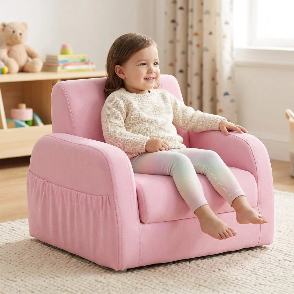 Fauteuil enfant rose pliable, assise et dossier rembourrés, accoudoirs arrondis