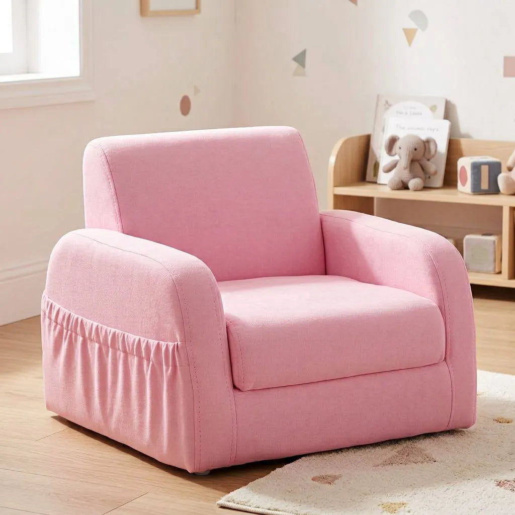 Fauteuil enfant rose avec assise large et accoudoirs, dossier incliné