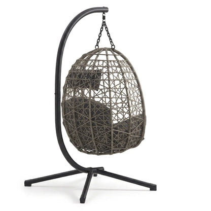 Fauteuil suspendu cocon en rotin avec coussins gris foncé et support noir à 3 pieds