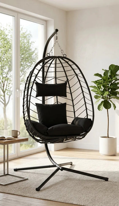 Fauteuil suspendu noir sur pied, coussins d’assise, structure en treillis