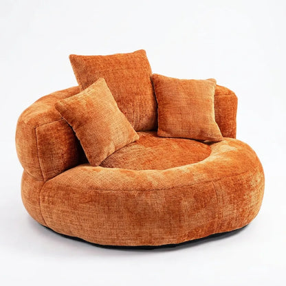 Fauteuil rond en tissu orange avec dossier haut et trois coussins.